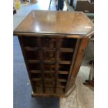 A MAHOGANY WINE RACK WITH A CUPBOARD TO HOLD SIX WINE GLASSES