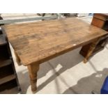 A RECTANGULAR PINE DINING TABLE