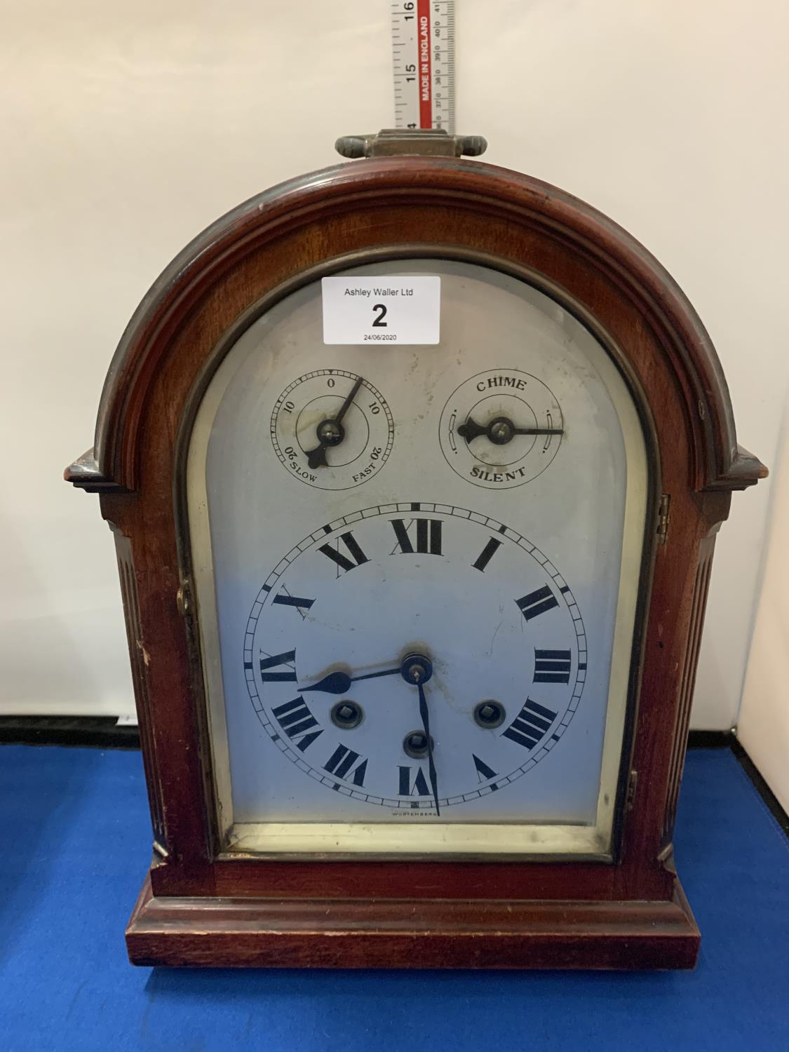 A GERMAN WURTENBURG MAHOGANY CASED WESTMINSTER CHIMING BRACKET CLOCK WITH FAST SLOW DIAL AND CHIME