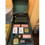 A VINTAGE CASED REMINGTON PORTABLE TYPEWRITER WITH PAPER AND OTHER OFFICE ITEMS