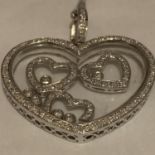 9CT HALLMARKED WHITE GOLD DIAMOND SET FLOATING HEART PENDANT & FINE CURB CHAIN. TOTAL GROSS WEIGHT