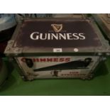 A VINTAGE INDUSTRIAL STYLE GUINNESS LEATHER EFFECT STORAGE TRUNK 46CM