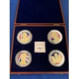A BOXED SET OF FOUR LARGE COINS DEPICTING 1936 THREE KINGS