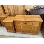 A PINE BEDSIDE CABINET AND A PINE CHEST OF TWO SHORT AND TWO LONG DRAWERS