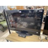 A HITACHI 32" TV WITH REMOTE - IN WORKING ORDER