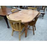 A PINE DINING TABLE WITH TWO PINE AND TWO BEECH DINING CHAIRS