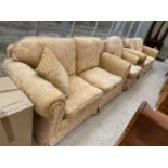 A GOLD TWO SEATER SOFA AND TWO ARMCHAIRS