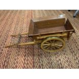 A HAND MADE WOODEN CART