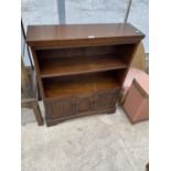 A PRIORY STYLE OAK TWO TIER BOOKCASE WITH TWO LOWER DOORS