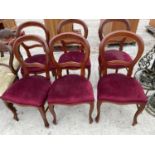 A SET OF SIX MAHOGANY DINING CHAIRS WITH RED UPHOLSTERY