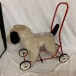 A VIC-TREE TOY DOG ON WHEELS