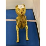 A HAND CARVED VINTAGE STYLE NOVELTY WOODEN LUCKY GOLD YELLOW TEDDY BEAR SHELF PUPPET