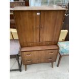 A WRIGHTON RETRO TEAK DRESSING CABINET WITH TWO DOORS AND TWO DRAWERS