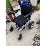 A FREEDOM CHAIR FOLDING ELECTRIC WHEELCHAIR WITH CARRY BAG - POWERS UP BUT NO CHARGER WITH LOT