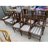 A MAHOGANY EIGHT PIECE DINING ROOM SET - A TWO SEATER, FOUR DINING CHAIRS, TWO CARVERS AND A STOOL
