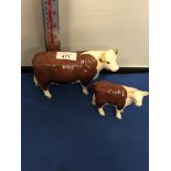A BESWICK HEREFORD COW AND CALF FIGURES, BOXED