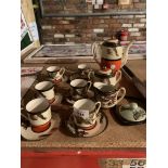 A JAPANESE COFFEE SET COMPRISING OF SIX CUPS AND SAUCERS, COFFEE POT, MILK JUG AND SUGAR BOWL