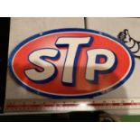 AN STP METAL ADVERTISING SIGN