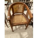 A MAHOGANY ARMCHAIR WITH RATTAN SEAT AND BACK