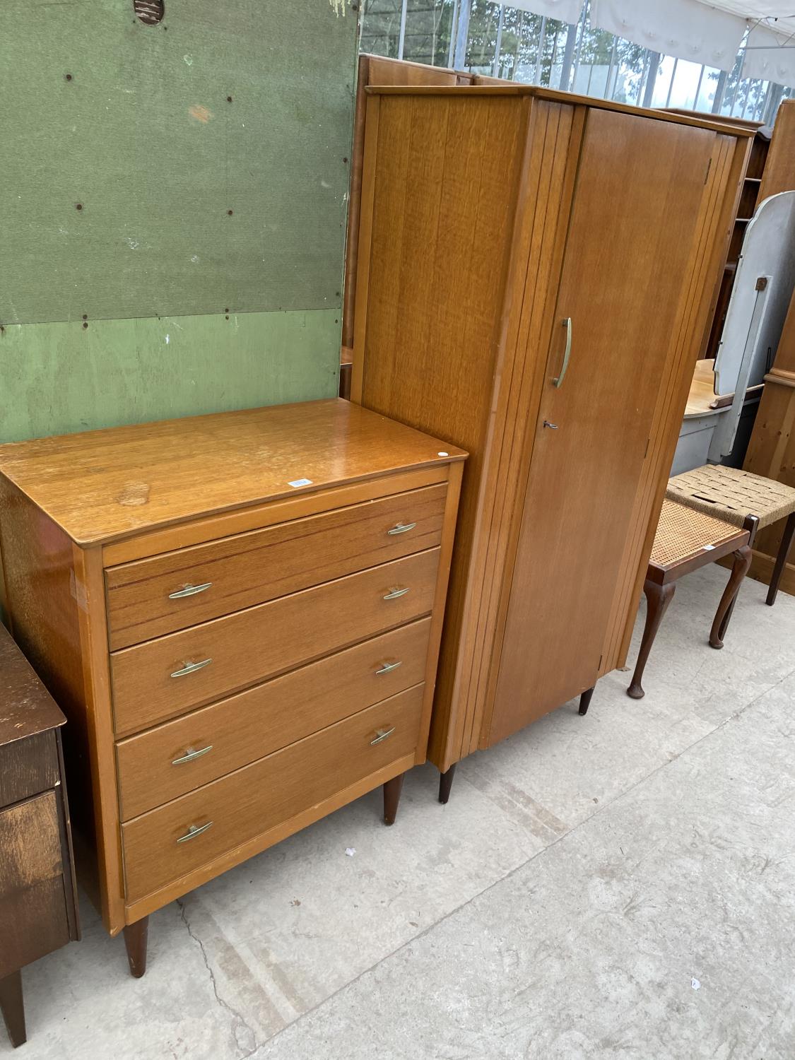 A LEBUS TEAK CHEST OF FOUR DRAWERS AND A MATCHING WARDROBE
