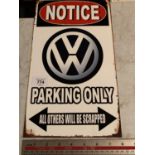 A 'VW PARKING' ONLY METAL ADVERTISING SIGN