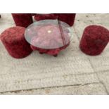 A RED ROSE PATTERNED GLASS TOP TABLE AND TWO MATCHING STOOLS