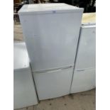 A FRIDGE FREEZER - IN WORKING ORDER