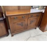 A MAHOGANY SIDEBOARD WITH TWO CARVED PANEL DOORS AND TWO DRAWERS