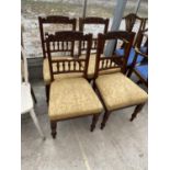 FOUR CARVED MAHOGANY DINING CHAIRS