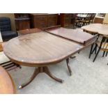 A MAHOGANY EXTENDING DINING TABLE ON TWIN PEDESTAL SUPPORTS