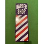 A BARBER SHOP ADVERTISING SIGN