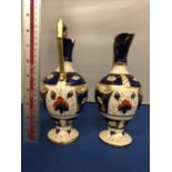 A PAIR OF ANTIQUE KENSINGTON IMARI PATTERN EWERS 21 CM