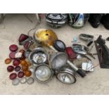 A LARGE QUANTITY OF VINTAGE CAR HEADLIGHTS, INDICATOR COVERS, MIRRORS ETC