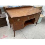 AN INLAID MAHOGANY BOW FRONT SIDEBOARD WITH TWO DOORS AND TWO DRAWERS - LEG REQUIRES REPAIR