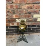 AN ARTS AND CRAFTS BRASS AND METAL OIL LAMP