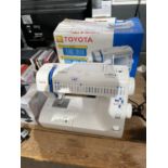 A TOYOTA SEWING MACHINE - IN WORKING ORDER