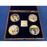 A BOXED SET OF FOUR LARGE COINS DEPICTING JUBILEE CELEBRATIONS