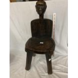 AN AFRICAN WOODEN CHAIR WITH A TRIBAL FIGURE HEAD