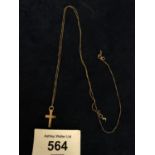 A FINE YELLOW METAL CROSS PENDANT AND CHAIN