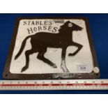 A CAST STABLES HORSES SIGN