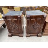 TWO VICTORIAN MAHOGANY DESK PEDESTALS WITH CARVED PANEL DOORS AND INNER CAMPAIGN STYLE DRAWERS