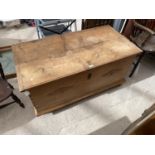 A PINE BLANKET CHEST WITH INNER CANDLE BOX