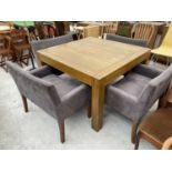 A MODERN OAK DINING TABLE AND FOUR LARGE DINING CHAIRS