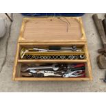 A WOODEN CASE CONTAINING SOCKETS, TOOLS ETC