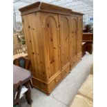 TWO PINE WARDROBES EACH WITH TWO DOORS AND TWO DRAWERS (ONE REQUIRES UPPER CORNICE RE-ATTACHING)