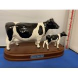 FRIESIAN COW AND CALF FIGURE ON WOODEN PLINTH