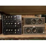 THREE SANSUI AMPLIFIERS AND A PAIR OF SPEAKERS