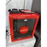 A HUSKY COCA COLA MINI DRINKS FRIDGE, IN CLEAN CONDITION AND IN WORKING ORDER