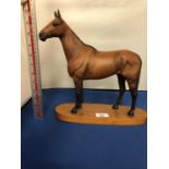 A BESWICK CONNOISSEUR MODEL OF ARKLE , CHAMPION STEEPLE CHASER MATT BROWN ON A WOODEN PLINTH STAMPED