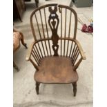 AN ELM SEATED WINDSOR CHAIR - REQUIRES REPAIR TO TOP RAIL